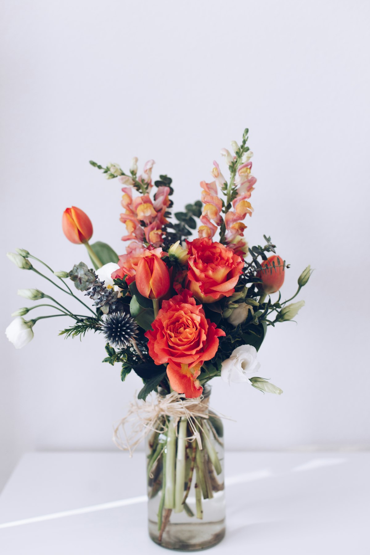Ember & Ash — Garden Rose, Ranunculus, Snapdragon, Smoke Bush